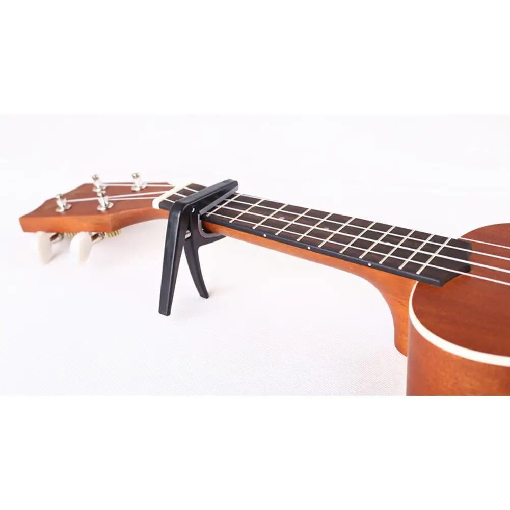 Professional Ukulele Capo Single-handed Quick Change Ukelele Capo 4 Strings Hawaii Guitar Capos Guitar Parts & Accessories